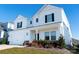 Two-story white house with black shutters, two-car garage, and landscaping at 3962 Isenhour Rd, Kannapolis, NC 28081