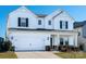 Two-story white house with black shutters, two-car garage, and landscaping at 3962 Isenhour Rd, Kannapolis, NC 28081