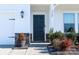 Front entrance with dark blue door, stone accents, and landscaping at 3962 Isenhour Rd, Kannapolis, NC 28081