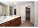 Double vanity bathroom with a large mirror and walk-in closet at 4182 Cordell Ct, Midland, NC 28107