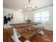 Farmhouse style dining set with wood table and benches in a bright dining room at 4182 Cordell Ct, Midland, NC 28107