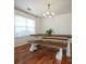 Farmhouse style dining set with wood table and benches in a bright dining room at 4182 Cordell Ct, Midland, NC 28107