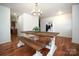 Farmhouse style dining set with wood table and benches in a bright dining room at 4182 Cordell Ct, Midland, NC 28107