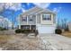 Two-story house with gray siding, stone accents, and a two-car garage at 4182 Cordell Ct, Midland, NC 28107