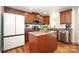 Modern kitchen featuring an island, stainless steel appliances, and wood cabinets at 4182 Cordell Ct, Midland, NC 28107