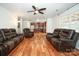 Open living room with hardwood floors and a view of the kitchen at 4182 Cordell Ct, Midland, NC 28107