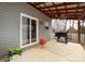 Covered patio with grill and sliding glass door access at 4182 Cordell Ct, Midland, NC 28107