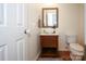 Small bathroom with pedestal sink, toilet, and framed mirror at 4182 Cordell Ct, Midland, NC 28107