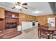 Basement kitchenette with brick fireplace and white cabinets at 421 Wood Bridge Rd, Statesville, NC 28625