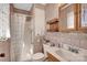 Clean bathroom with shower/tub combo, wood vanity, and tiled walls at 421 Wood Bridge Rd, Statesville, NC 28625