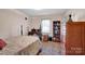 Bedroom with a double bed, desk, and ample closet space at 421 Wood Bridge Rd, Statesville, NC 28625