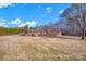 Rear view of brick ranch house, large yard at 421 Wood Bridge Rd, Statesville, NC 28625