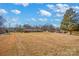 Ranch style brick house with large yard and detached garage at 421 Wood Bridge Rd, Statesville, NC 28625