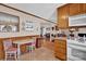 Kitchen with wood cabinets, granite countertops and breakfast nook at 421 Wood Bridge Rd, Statesville, NC 28625