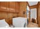 Laundry room with washer, dryer, and wooden cabinets at 421 Wood Bridge Rd, Statesville, NC 28625