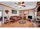 Spacious living room with hardwood floors, a ceiling fan, and a view into another room at 421 Wood Bridge Rd, Statesville, NC 28625