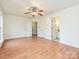 Bright bedroom featuring wood flooring and a ceiling fan at 4211 Suttle Pl, Matthews, NC 28104