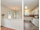 Well-equipped kitchen with white cabinets and tile floor at 4211 Suttle Pl, Matthews, NC 28104