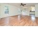 Living room with hardwood floors and kitchen views at 4211 Suttle Pl, Matthews, NC 28104