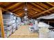 Spacious attic area with exposed wood beams and ample storage, perfect for organization at 4334 Silo Ln, Charlotte, NC 28226