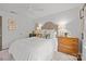 Bedroom featuring a patterned headboard, a white comforter and lots of natural light at 4334 Silo Ln, Charlotte, NC 28226