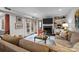 Spacious living room with a fireplace, built-in shelves, and French doors leading outside at 4334 Silo Ln, Charlotte, NC 28226