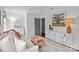 Bright living room with white sofa, colorful pillows, decorative table and artwork at 4334 Silo Ln, Charlotte, NC 28226