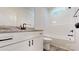 Modern bathroom showcasing a white vanity with a granite countertop, an undermount sink, and black hardware at 4607 Ferguson Cir, Waxhaw, NC 28173