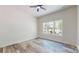 Bright bedroom features a ceiling fan and a large window with a peaceful view at 4607 Ferguson Cir, Waxhaw, NC 28173