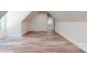 Bonus room featuring vaulted ceilings, light wood flooring, and natural light at 4607 Ferguson Cir, Waxhaw, NC 28173