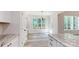 Charming breakfast nook with white cabinetry and large windows offering wooded view at 4607 Ferguson Cir, Waxhaw, NC 28173