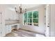 Bright breakfast nook with ample cabinetry and large windows offering a wooded view at 4607 Ferguson Cir, Waxhaw, NC 28173