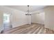 Open dining room features modern light fixture and wood floors at 4607 Ferguson Cir, Waxhaw, NC 28173