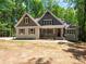 Charming craftsman-style home with gabled roof, welcoming front porch, and mature landscaping at 4607 Ferguson Cir, Waxhaw, NC 28173