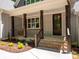 Charming front entrance with a covered porch and landscaped garden at 4607 Ferguson Cir, Waxhaw, NC 28173