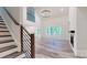 Spacious living room boasts soaring ceilings, a fireplace, and elegant staircase at 4607 Ferguson Cir, Waxhaw, NC 28173