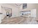 Spacious living room with high ceilings, modern staircase, hardwood flooring, and an open-concept design at 4607 Ferguson Cir, Waxhaw, NC 28173