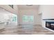 Spacious living room with a fireplace, high ceilings, and multiple windows at 4607 Ferguson Cir, Waxhaw, NC 28173