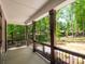 Covered porch with wood columns overlooking a green backyard at 4607 Ferguson Cir, Waxhaw, NC 28173