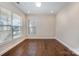 Bedroom with hardwood floors, large windows, and neutral wall color at 5115 Waterloo Dr, Fort Mill, SC 29708