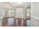 Bright foyer with gleaming hardwood floors, elegant trim, and a view into the formal dining room at 5115 Waterloo Dr, Fort Mill, SC 29708