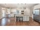 Bright kitchen with stainless steel appliances, granite countertops, hardwood floors, and a center island at 5115 Waterloo Dr, Fort Mill, SC 29708