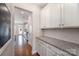 Kitchen area with granite countertops, subway tile backsplash and white cabinets at 5115 Waterloo Dr, Fort Mill, SC 29708