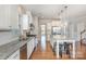 Modern kitchen featuring granite counters, stainless steel appliances and a large island with bar stool seating at 5115 Waterloo Dr, Fort Mill, SC 29708