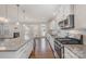 Modern kitchen featuring stainless steel appliances and a large island with pendant lighting at 5115 Waterloo Dr, Fort Mill, SC 29708