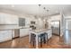 Bright kitchen with stainless steel appliances, granite countertops, hardwood floors, and a center island at 5115 Waterloo Dr, Fort Mill, SC 29708