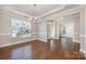 Open concept living space with hardwood floors and a view into the foyer at 5115 Waterloo Dr, Fort Mill, SC 29708