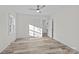 Well-lit bedroom with hardwood floors and access to another room at 529 Ambassador St, Charlotte, NC 28208