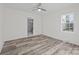 Bedroom with hardwood floors and ceiling fan, view of bathroom at 529 Ambassador St, Charlotte, NC 28208