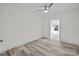 Bedroom with wood-look floors, ceiling fan and access to sunroom at 529 Ambassador St, Charlotte, NC 28208